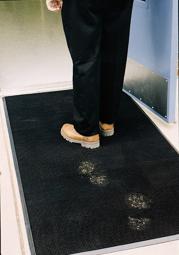 Flex Tip Entrance Mat Scraping Mud off of boots