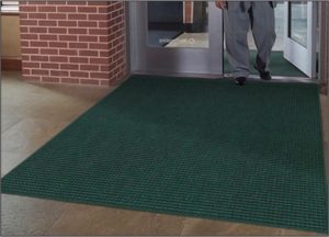Waterhog Drainable floor mat used as outdoor entrance mat to a school