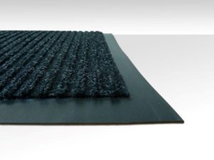 Close up corner view of Dual Rib Walk off matting in a charcoal color showing the smooth vinyl edges and ribbed surface pattern