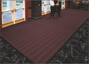Large floor mat custom cut in hotel lobby entrance using Waterhog Eco Elite Roll Goods entrance matting