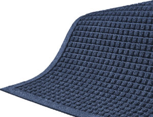 Close up corner view of Waterhog Classic entry mat with fashion border with floor mat color of Medium Blue