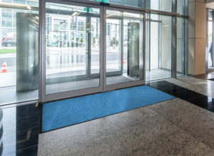 Waterhog Classic Diamond walk off mat used as an indoor door mat to an office building as a Zone 3 floor mat