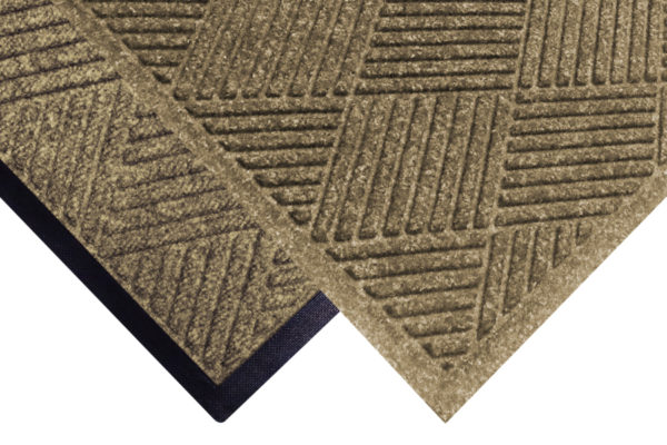 Corner view of Waterhog Classic Diamond floor mats with two floor mat edge options - Standard rubber and Fashion border edging