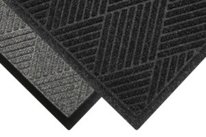 Corner View of Waterhog Eco Premier floor matting with two floor mat edge options - Standard Rubber and Fashion Border