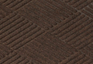 Close up surface view of Waterhog Eco Premier carpet mat in a Chestnut Brown color