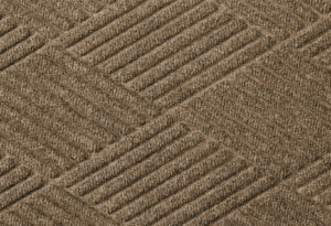 Close up surface view of Waterhog Eco Premier floor matting in a Khaki color
