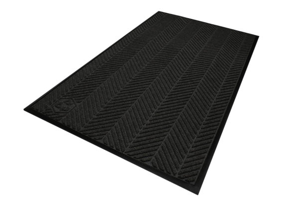 Corner view detailing surface pattern of a Waterhog Eco Elite entrance mat with standard edges in a Black smoke