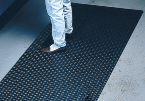 Man standing on Black Diamond Plate Nonslip Safety Floor Mat