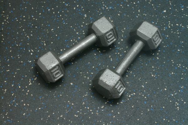 Dumbells resting on Heavy Duty Rolled Rubber Flooring for gyms - Blue Gray Color Fleck
