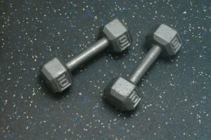 Dumbells resting on Rubber Gym Flooring for gyms - Blue Gray Color Fleck