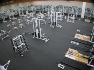 Commercial Gym with heavy duty rolled rubber flooring used under gym equipment