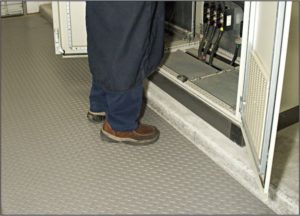 Man Standing on Gray Military Switchboard nonconductive floor matting to prevent electric shock