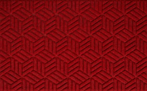 Close up view of a Solid Red Waterhog Legacy Classic entrance mat detailing the high tech floor surface pattern of the entry matting